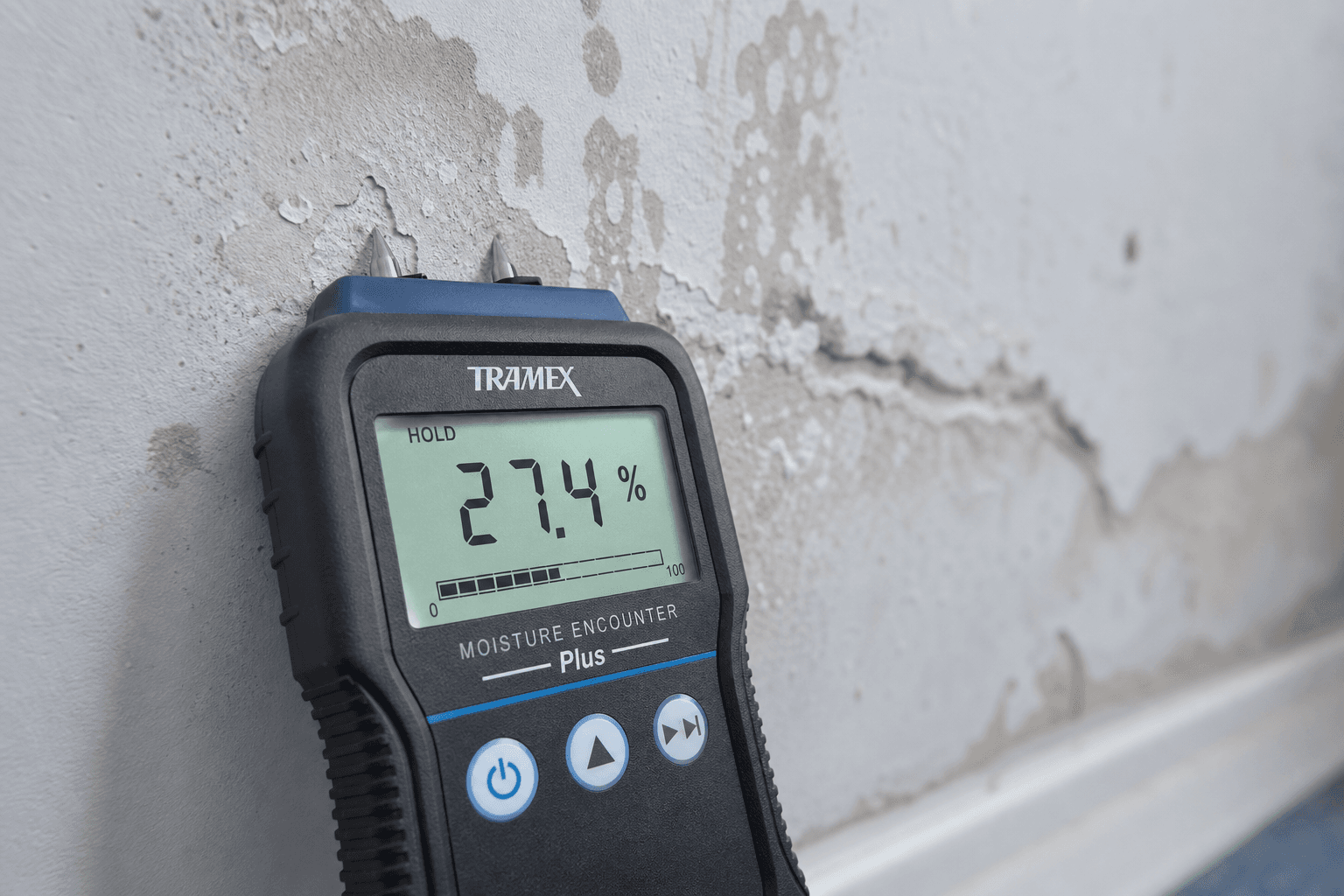 Moisture meter reading on water-damaged drywall — precision documentation for insurance claims